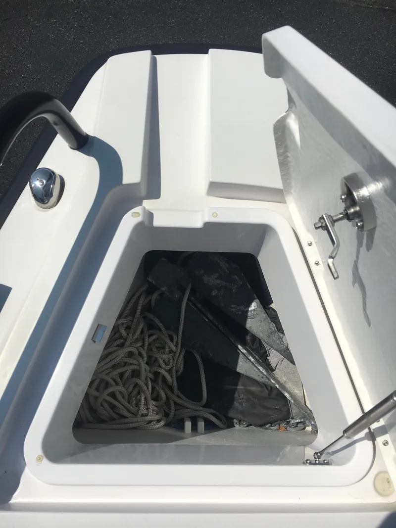 Slide: The Image of Storage compartment on a 2019 Axopar 28 CABIN boat with ropes and equipment. - 24