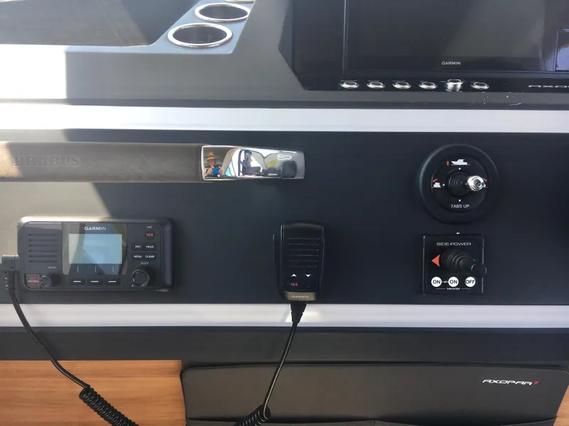 Slide: The Image of Control panel of 2019 Axopar 28 CABIN with Garmin electronics and side-power thruster. - 32
