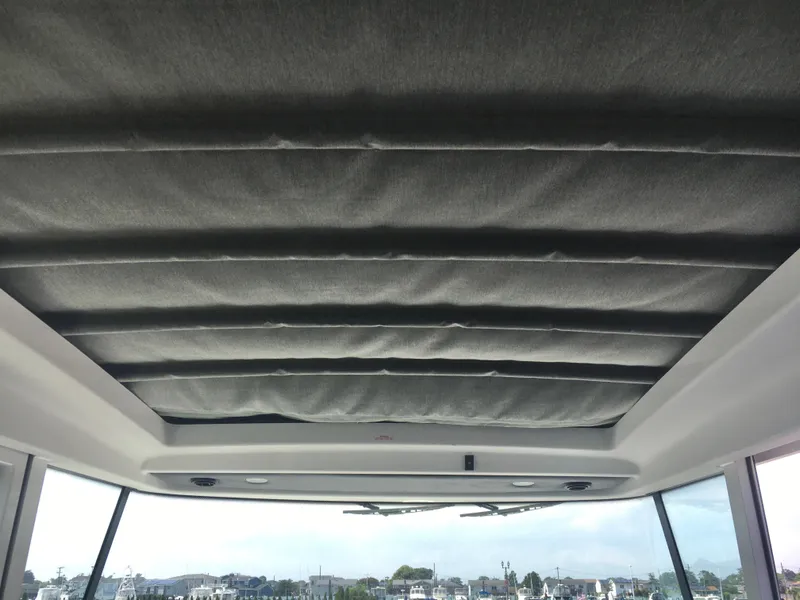 Slide: The Image of Interior view of 2019 Axopar 28 CABIN boat with padded ceiling. - 36