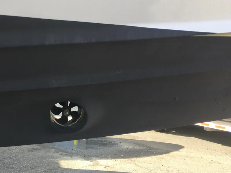 Slide: The Image of 2019 Axopar 28 CABIN hull with visible thruster on trailer. - 41