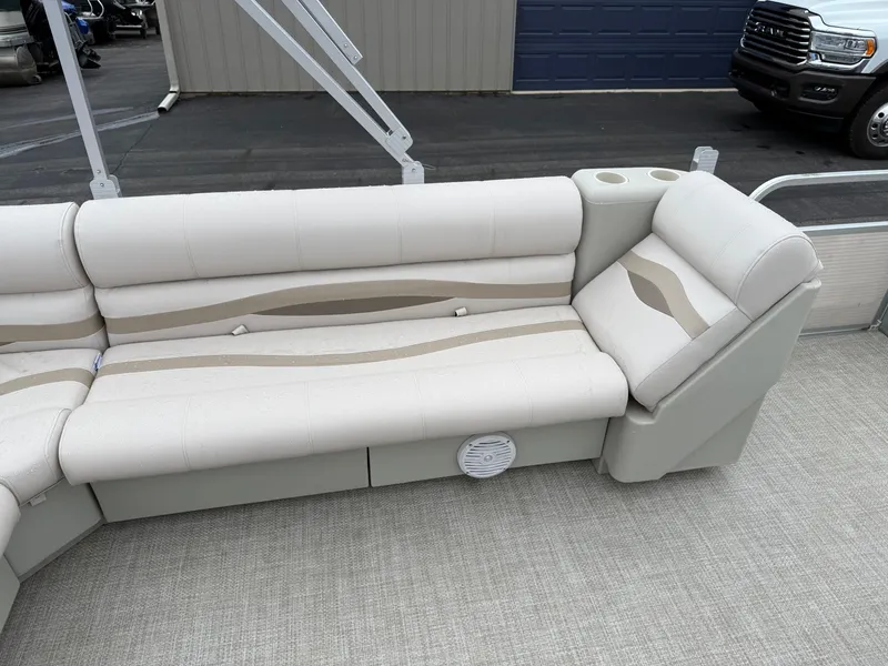 Slide: The Image of 1996 Premier Grand Majestic boat seating with beige upholstery and cup holder. - 10