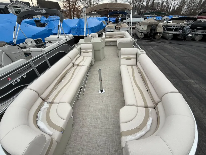 Slide: The Image of 1996 Premier Grand Majestic pontoon boat with spacious seating, docked among other boats. - 18