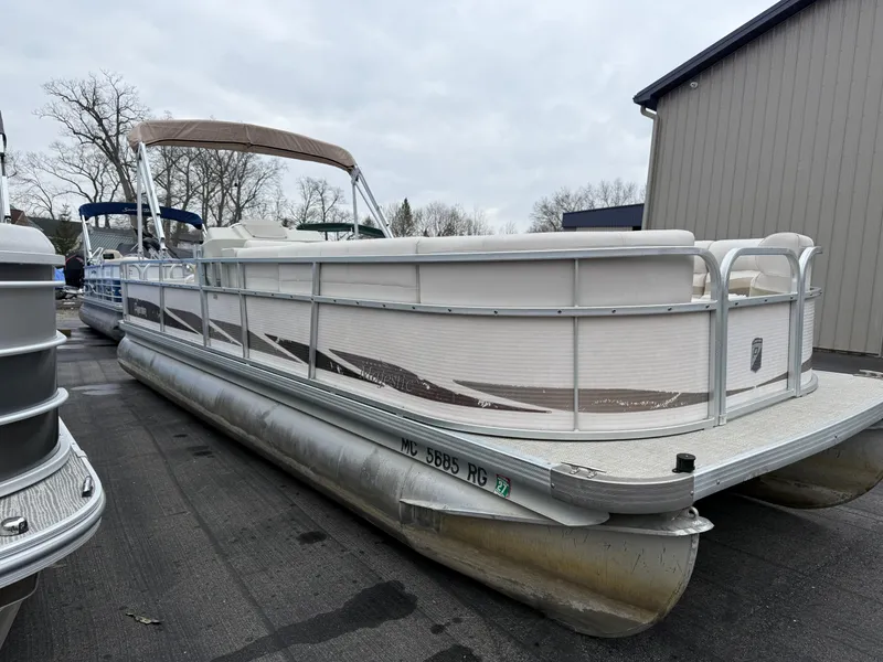 Slide: The Image of 1996 Premier Grand Majestic pontoon boat parked outdoors on a cloudy day. - 3