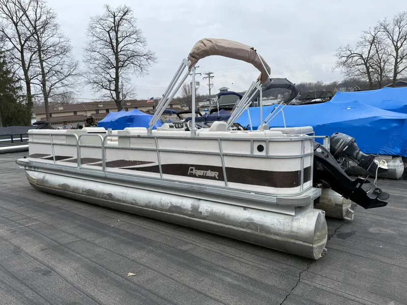 Slide: The Image of 1996 Premier Grand Majestic pontoon boat on display, featuring a sleek design and sturdy construction. - 4
