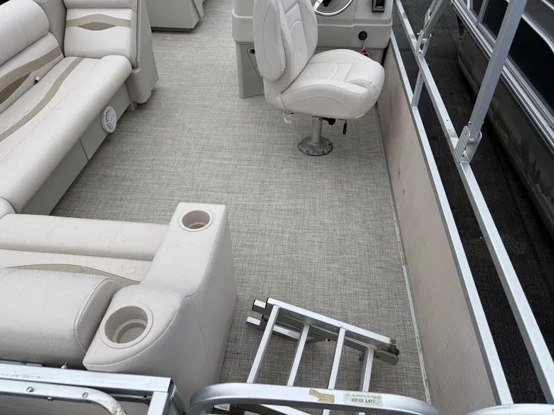 Slide: The Image of Interior of a 1996 Premier Grand Majestic boat with beige seating and carpet. - 7