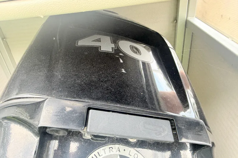 Slide: The Image of Close-up of a 1996 Premier Grand Majestic outboard motor, displaying the number 40. - 16