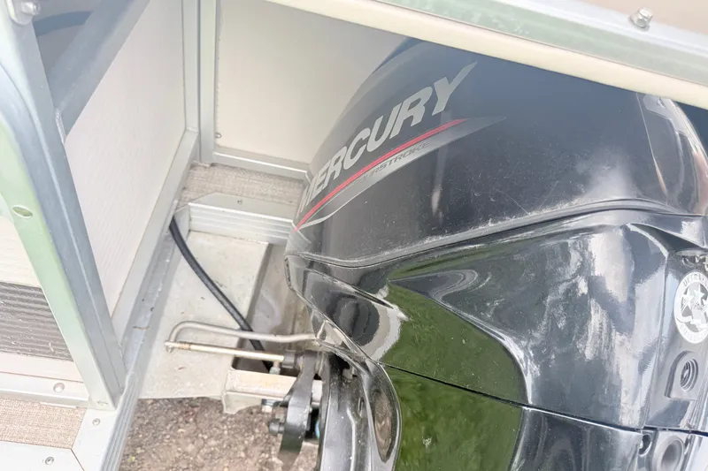 Slide: The Image of Mercury outboard motor in a 1996 Premier Grand Majestic boat compartment. - 15