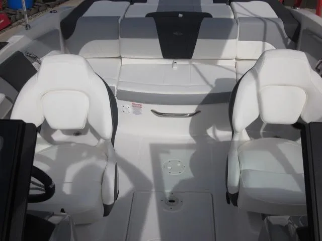 Slide: The Image of 2025 Chaparral 21 SSi boat interior with white seating and modern design. - 14