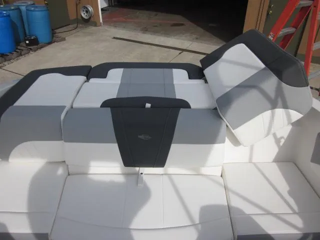 Slide: The Image of 2025 Chaparral 21 SSi boat interior with gray and white seating. - 21