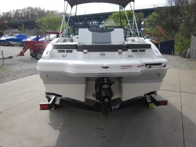 Slide: The Image of 2025 Chaparral 21 SSi boat, rear view, on trailer, outdoor setting. - 22