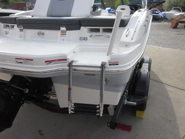 Slide: The Image of 2025 Chaparral 21 SSi boat rear view with swim platform and ladder. - 23