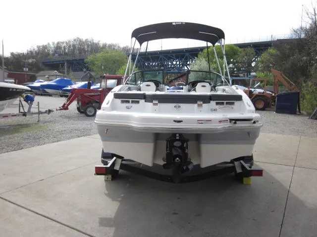 Slide: The Image of 2025 Chaparral 21 SSi boat on trailer, rear view, outdoor setting. - 4