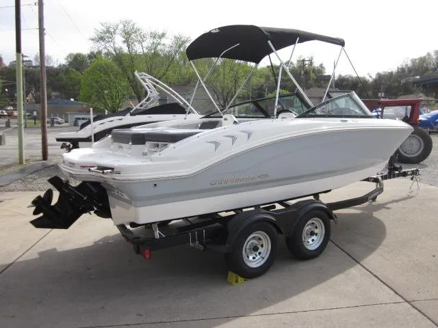 Slide: The Image of 2025 Chaparral 21 SSi boat on trailer, white exterior, parked outdoors. - 5