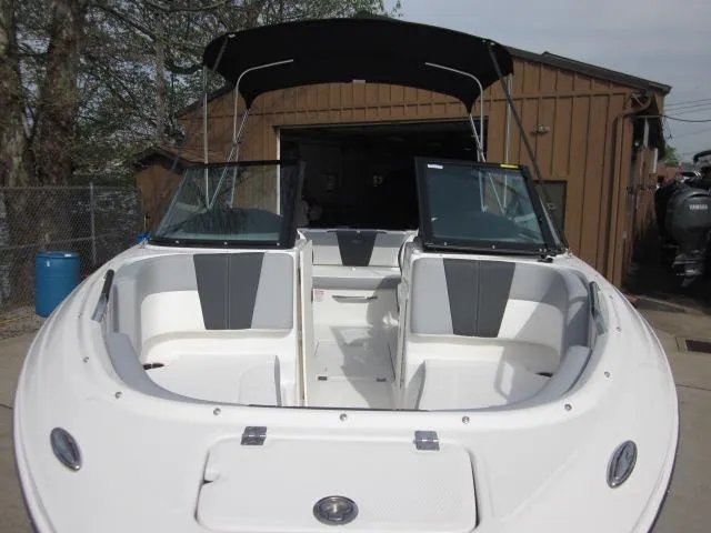 Slide: The Image of 2025 Chaparral 21 SSi boat with open bow seating and black canopy. - 9