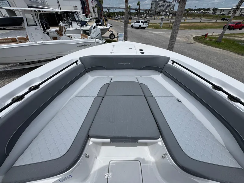Slide: The Image of 2025 NauticStar 292 Legacy boat with spacious seating and sleek design. - 12