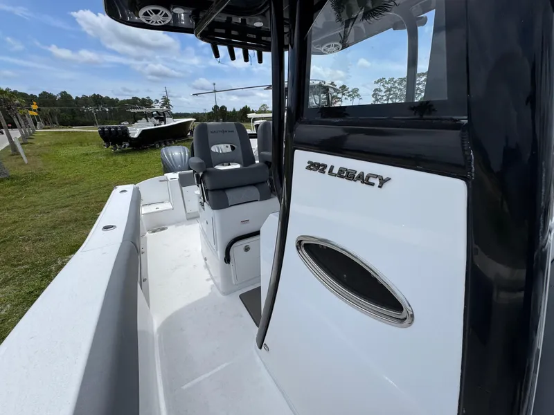 Slide: The Image of 2025 NauticStar 292 Legacy boat interior with seating and console details. - 16