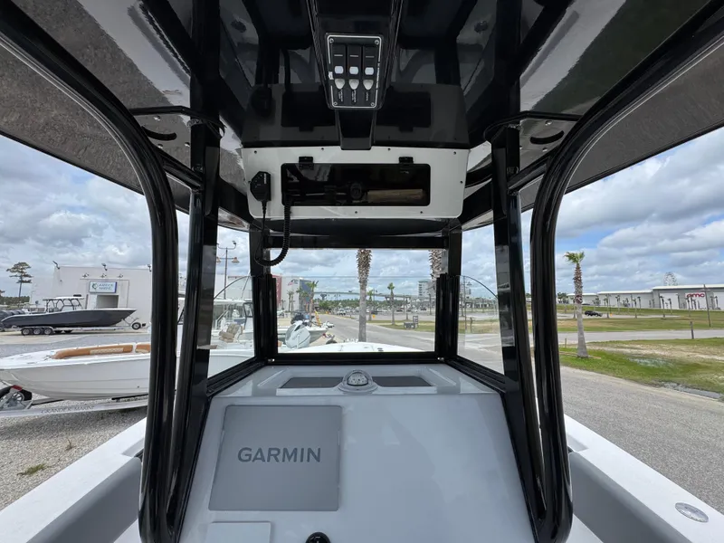 Slide: The Image of 2025 NauticStar 292 Legacy boat interior with Garmin navigation system. - 22