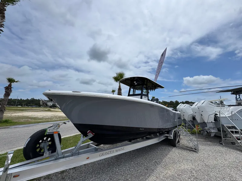 Slide: The Image of 2025 NauticStar 292 Legacy boat on trailer under cloudy sky. - 6