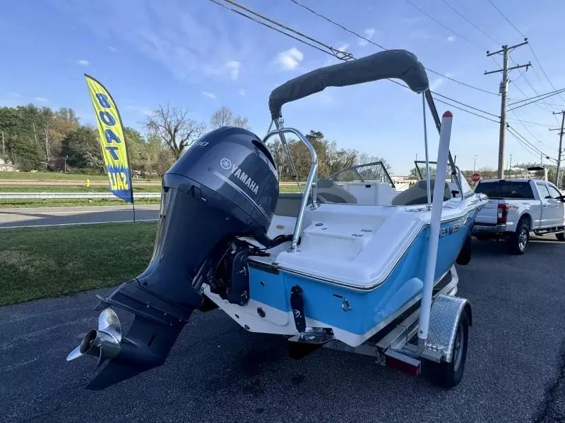 Slide: The Image of 2023 Key West 203 DFS boat with Yamaha engine on trailer, parked outdoors. - 5