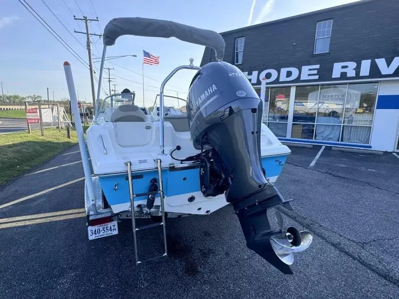 Slide: The Image of 2023 Key West 203 DFS boat with Yamaha engine, parked outside a marine store. - 8