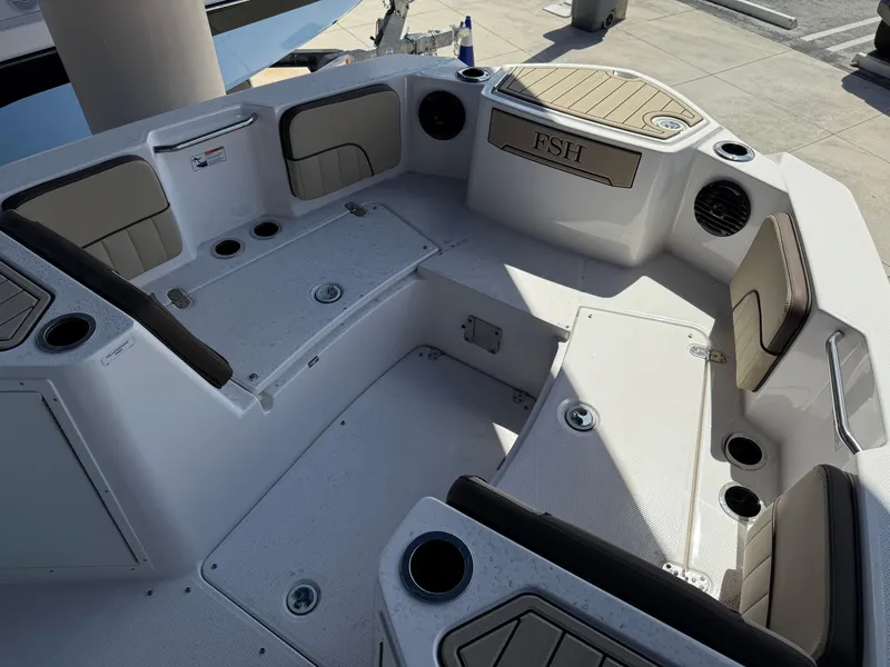 Slide: The Image of 2025 Yamaha Boats 222 FSH Sport E interior, featuring spacious seating and modern design. - 10