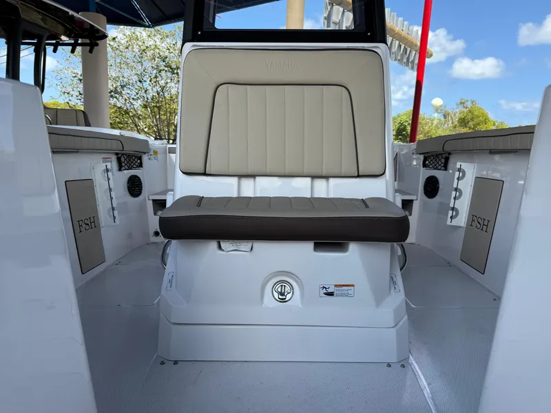 Slide: The Image of 2025 Yamaha Boats 222 FSH Sport E interior seating, featuring sleek design and comfortable upholstery. - 11