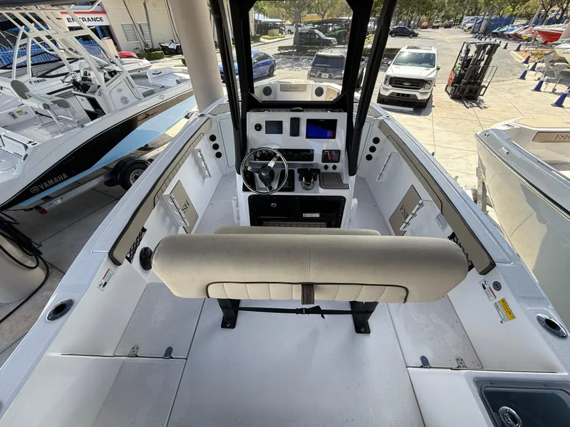 Slide: The Image of 2025 Yamaha Boats 222 FSH Sport E interior, featuring helm and seating area. - 7