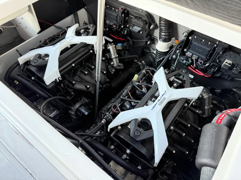 Slide: The Image of Engine compartment of 2025 Yamaha Boats 222 FSH Sport E, showcasing dual engines and components. - 8
