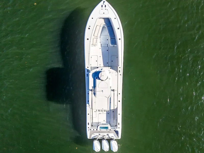Slide: The Image of Aerial view of 2021 Yellowfin 36 Offshore boat on green water. - 9