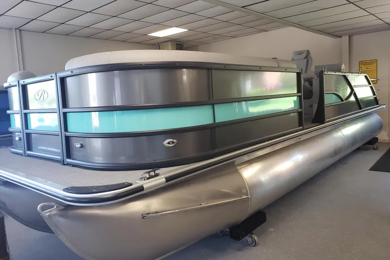 The Image of 2025 Bentley Pontoons Legacy Swingback in showroom, featuring sleek design and modern amenities. - 0