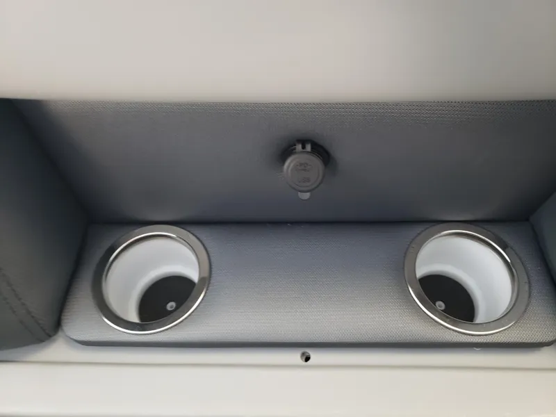 Slide: The Image of 2025 Bentley Pontoons Legacy Swingback cup holders and USB port detail. - 10