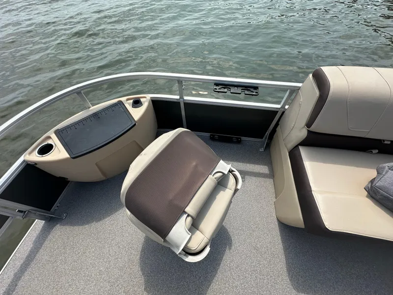 Slide: The Image of 2018 Sun Tracker Fishing Barge 22 interior with seating and water view. - 10
