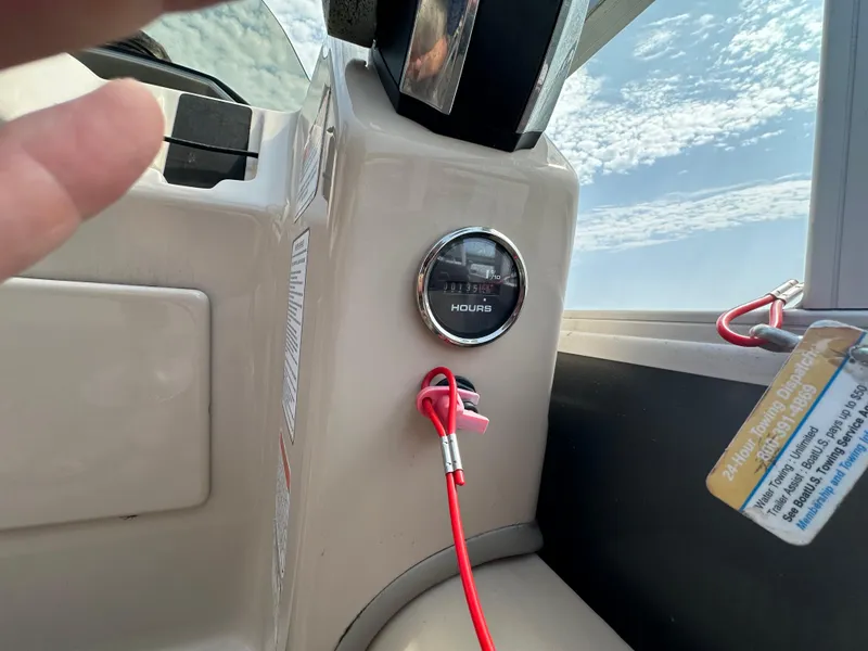 Slide: The Image of 2018 Sun Tracker Fishing Barge 22 dashboard with hour meter and safety lanyard. - 6