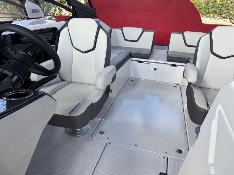 Slide: The Image of 2025 Yamaha AR250 boat interior with modern seating and sleek design. - 10