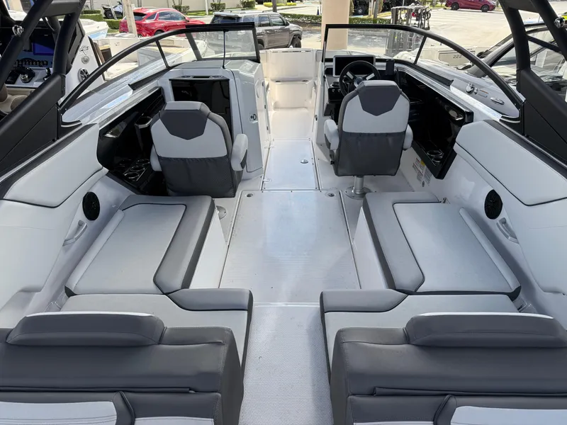Slide: The Image of 2025 Yamaha Boats AR250 interior with modern seating and sleek design. - 5