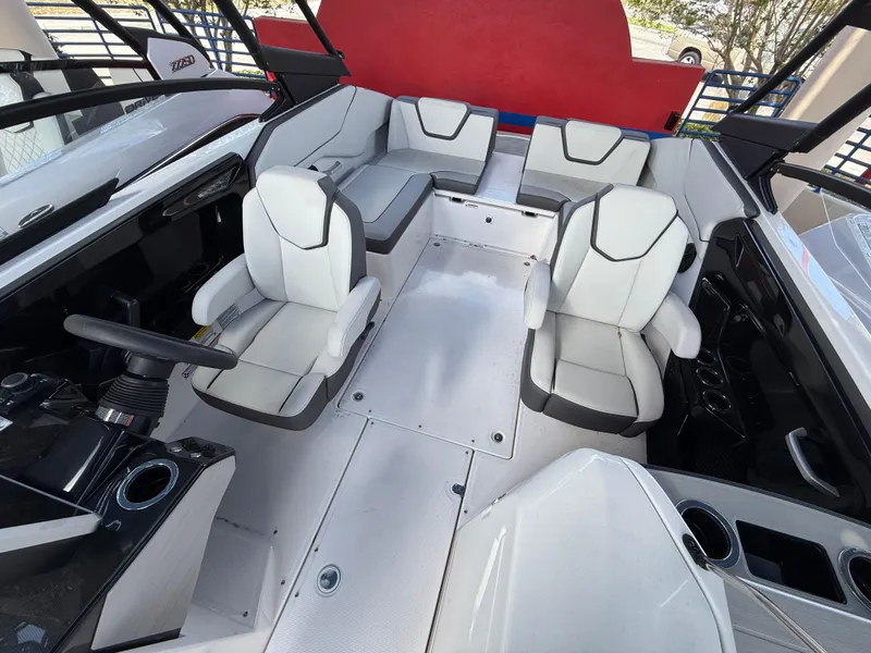 Slide: The Image of 2025 Yamaha Boats AR250 interior with modern seating and sleek design. - 6