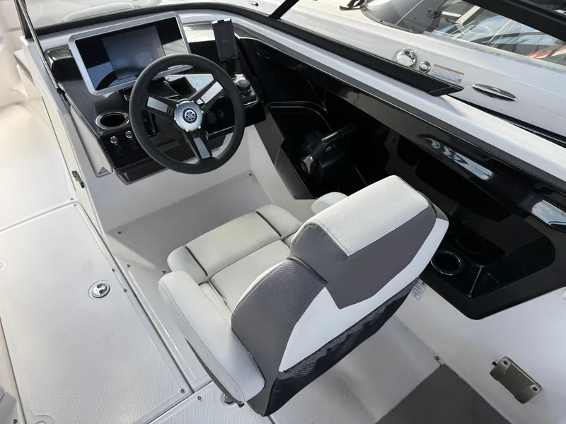 Slide: The Image of 2025 Yamaha Boats AR250 cockpit with modern steering and dashboard design. - 7