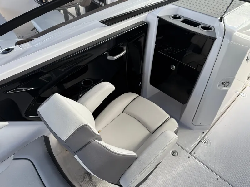 Slide: The Image of 2025 Yamaha Boats AR250 interior with sleek seating and modern console design. - 8
