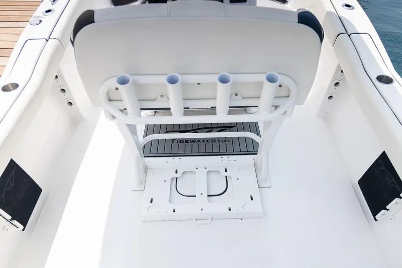 Slide: The Image of 2025 Tidewater 230 LXF boat interior with rod holders and seating. - 10