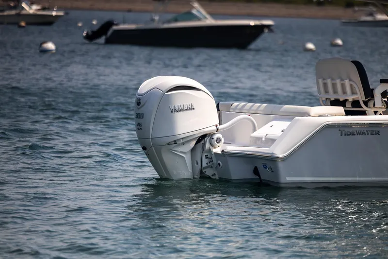 Slide: The Image of 2025 Tidewater 230 LXF boat with Yamaha outboard engine on water. - 25