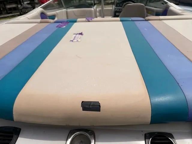 Slide: The Image of 1995 MasterCraft MARISTAR 225 VRS LT1 boat interior with colorful upholstery. - 10