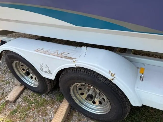 Slide: The Image of Trailer of 1995 MasterCraft MARISTAR 225 VRS LT1 with visible damage on fender. - 11