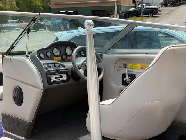 Slide: The Image of 1995 MasterCraft MARISTAR 225 VRS LT1 boat interior with steering wheel and dashboard controls. - 12