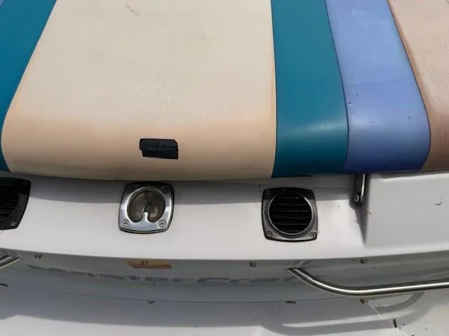 Slide: The Image of 1995 MasterCraft MARISTAR 225 VRS LT1 boat seat with colorful upholstery and metal fixtures. - 9