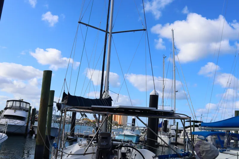 The Image of Sailboat docked at marina under blue sky, Hunter 37 model, 1997. - 0