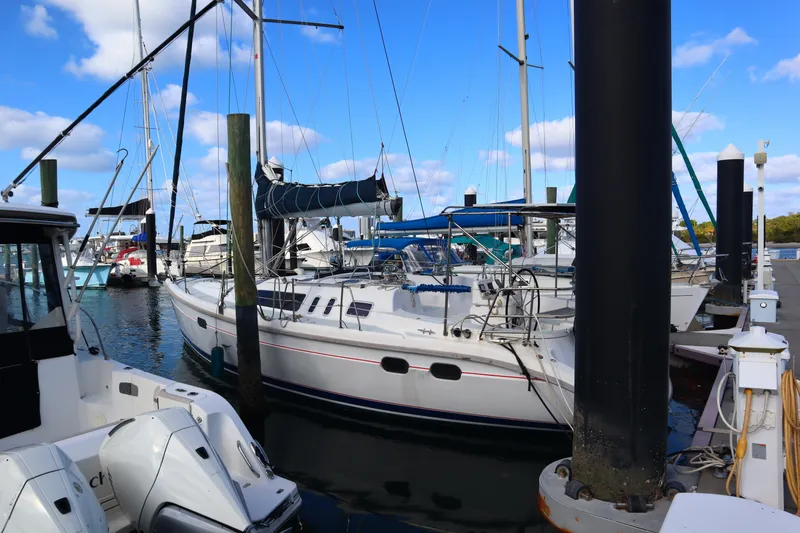 Slide: The Image of Sailboat docked at marina, Hunter 37 model, 1997, under clear blue sky. - 2