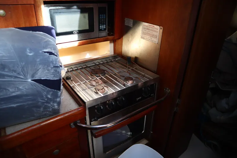 Slide: The Image of 1997 Hunter 37 yacht kitchen with stove, oven, and microwave. - 20