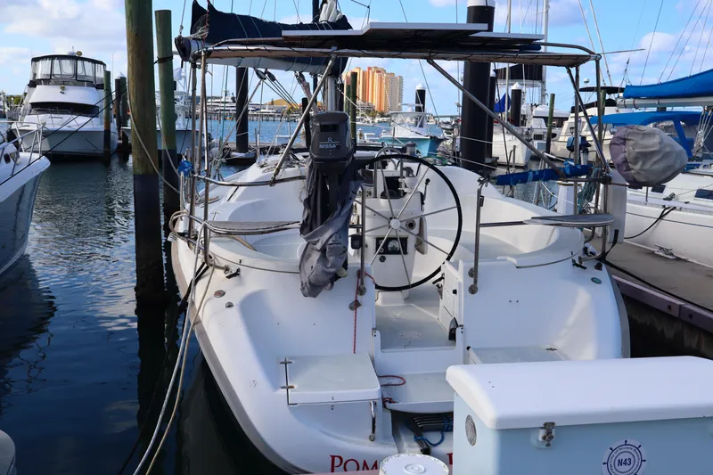 Slide: The Image of Sailboat docked at marina, 1997 Hunter 37 model, with clear blue sky background. - 4