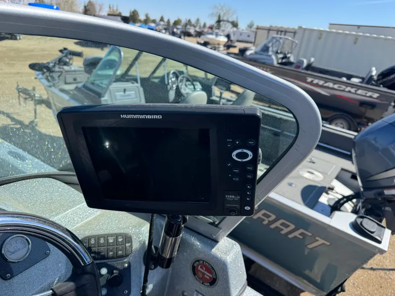 Slide: The Image of Boat dashboard with Humminbird fish finder on a 2016 Tuffy Osprey 2100. - 11