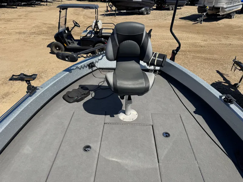 Slide: The Image of 2016 Tuffy Osprey 2100 boat with a central seat and fishing equipment. - 13